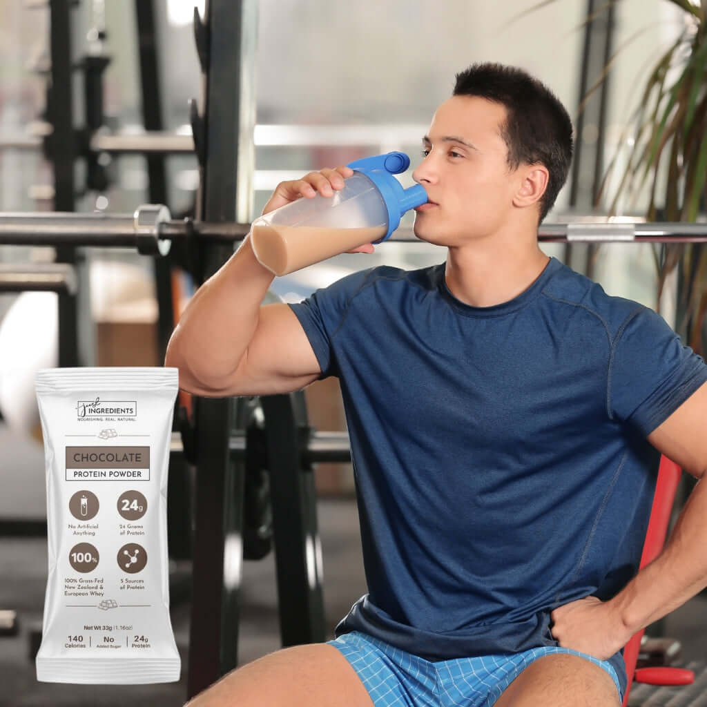 Man drinking Chocolate Protein Powder - Individual Stick from a shaker bottle at the gym.